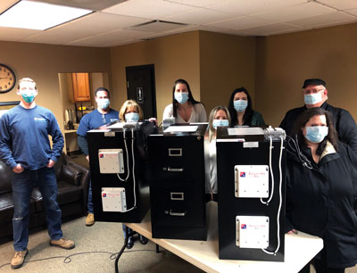 GallettAir employees with UVC Light disinfectant boxes for PPE